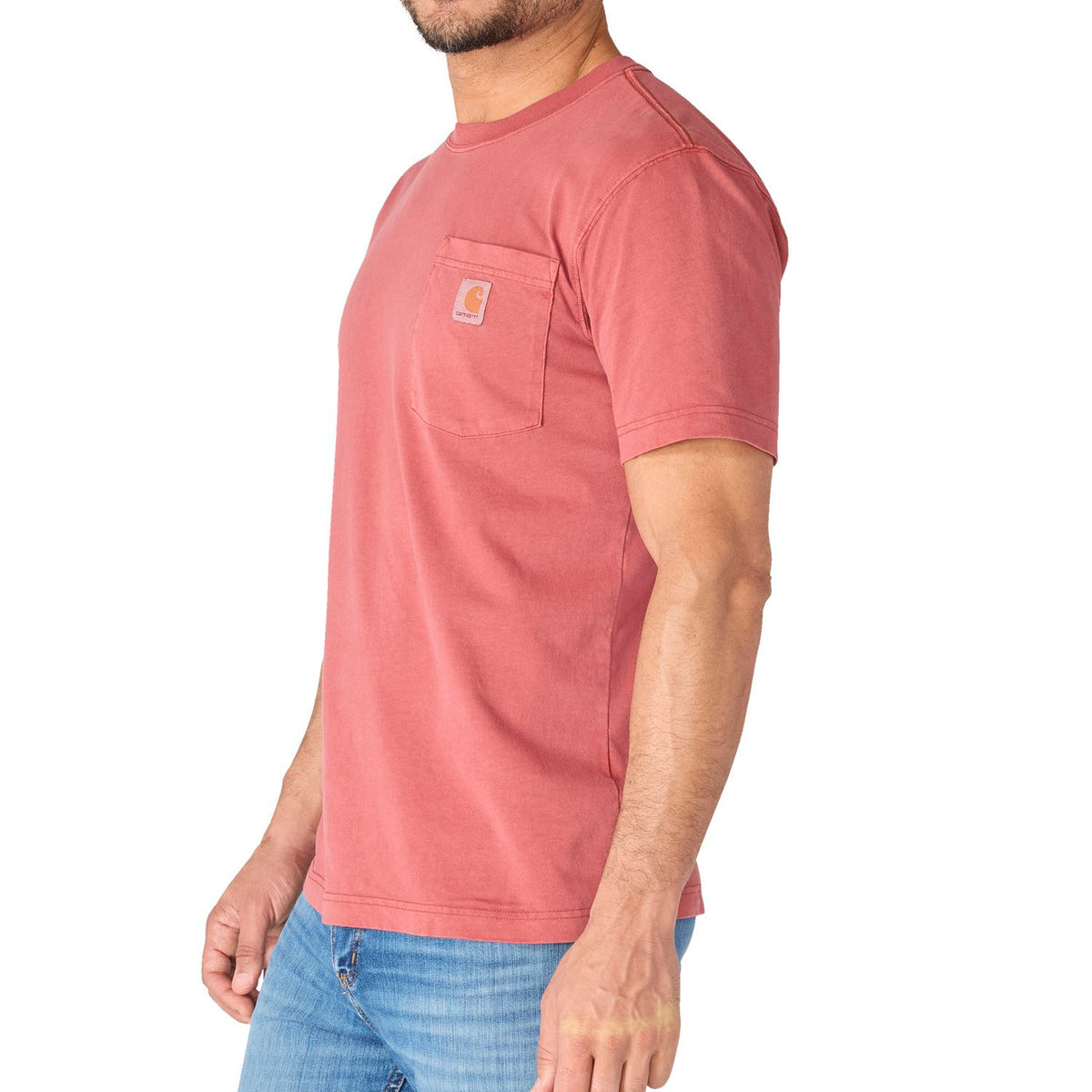Person wearing a red t-shirt with a pocket on a white background