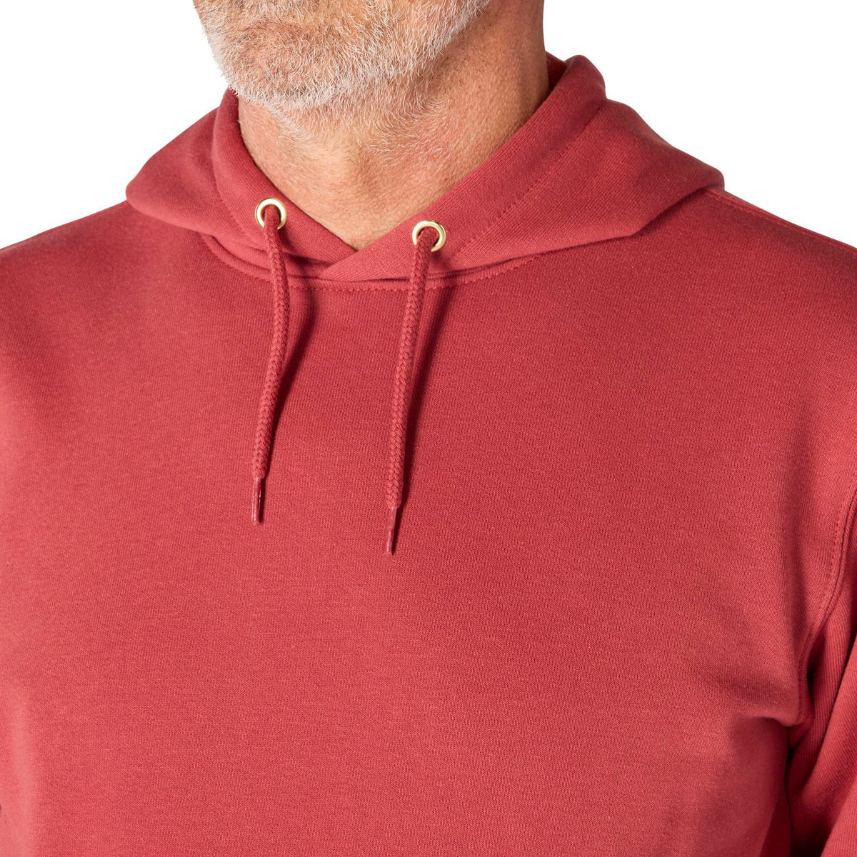 Red hoodie worn by a person on a white background