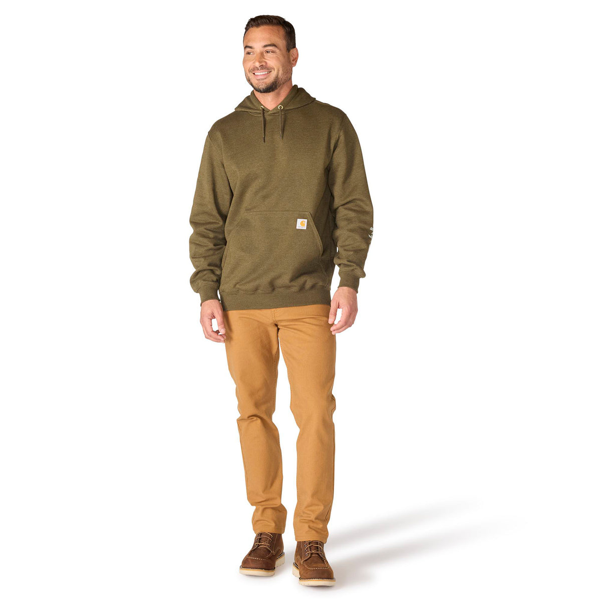 Man wearing a green hoodie and tan pants on a white background